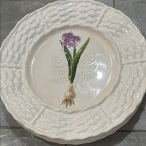 Three beautiful floral designed decorative plates 10 1/2” wide.